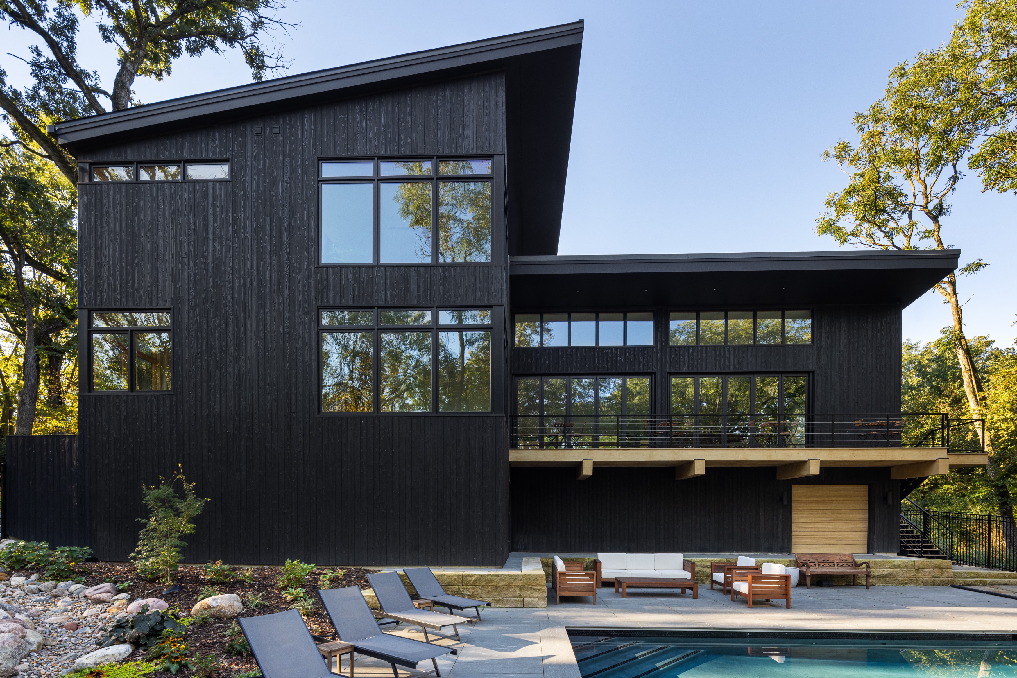 Modern black contemporary home with pool