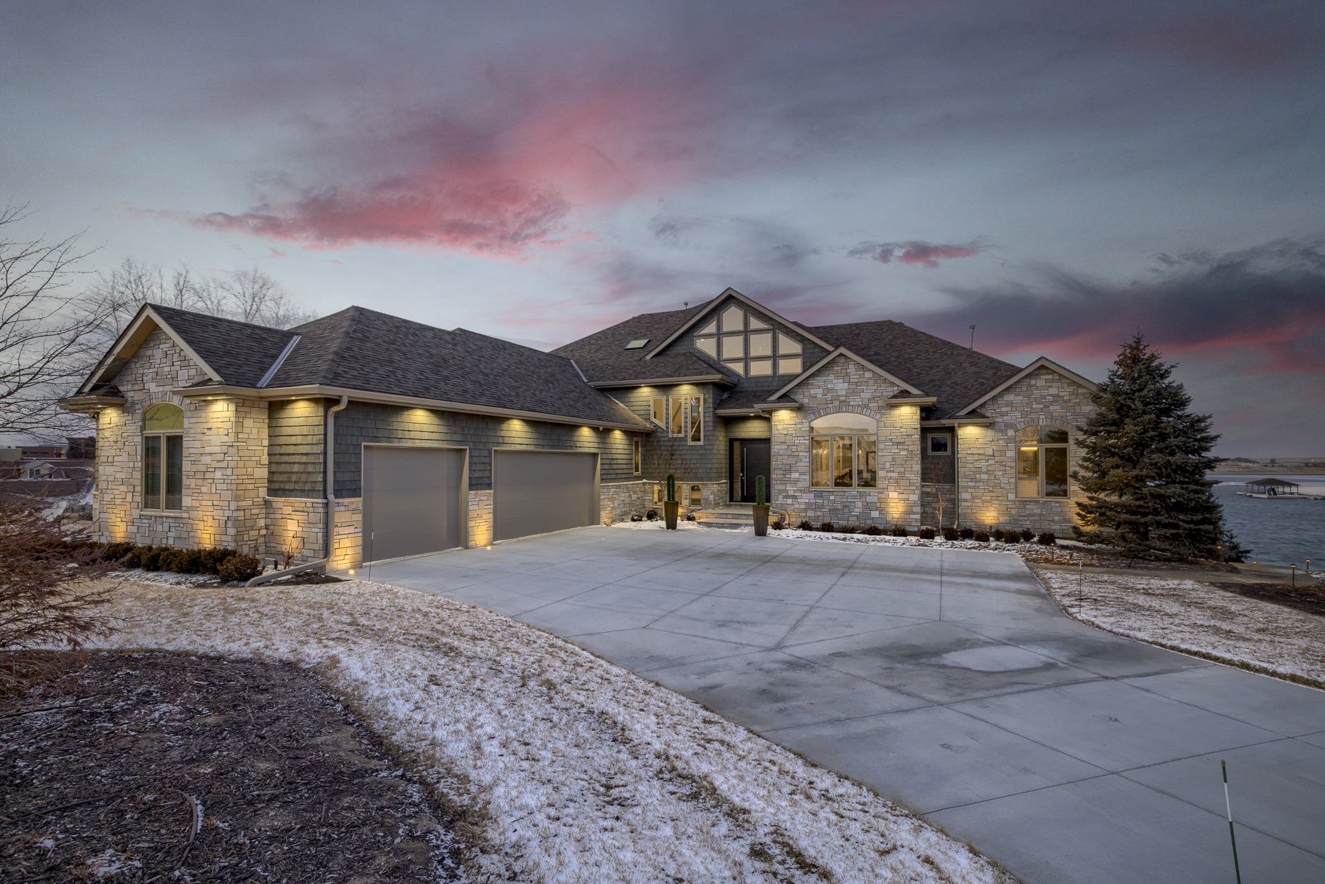 Traditional stone home exterior at sunset